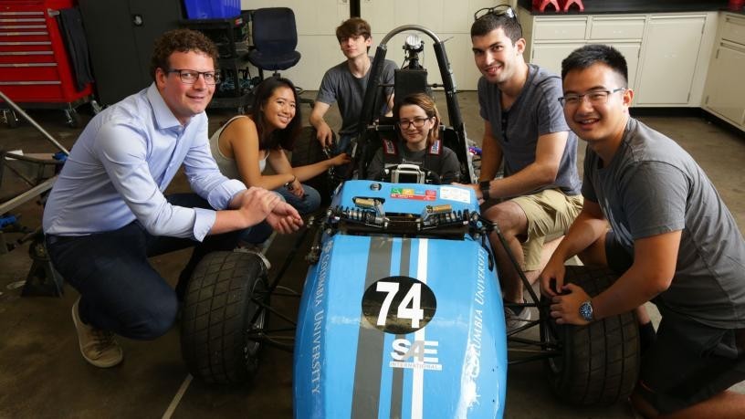 Photo of Prof. Preindl and students on the EV Formula SAE team